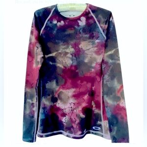 Oakley multi colored long sleeve sports top. Size S